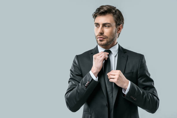 istock businessman in suit wearing tie 911971190