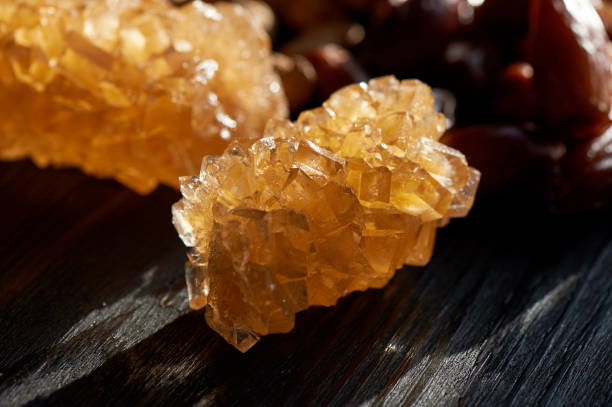 istock Brown grape sugar in transparent crystals.Eastern sweetness to the tea 911971622