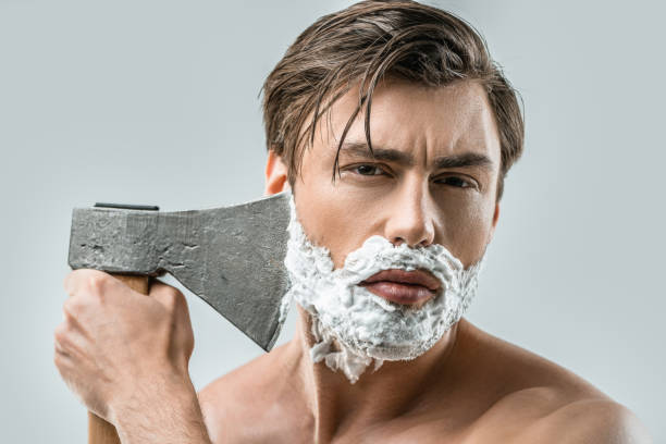 istock man in foam shaving with ax 911971630