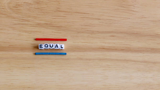 EQUAL text cube and two color stick on the wood background. EQUAL text cube and two color stick on the wood background. tetragon stock pictures, royalty-free photos & images
