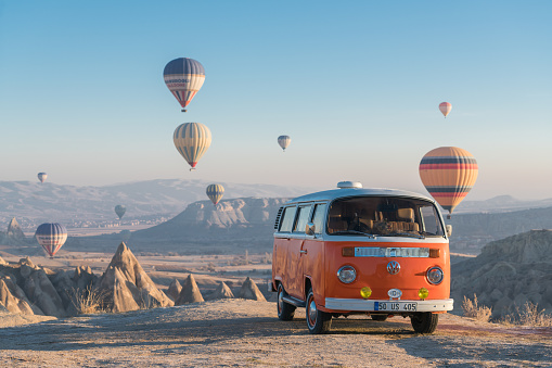 Cappadocia,Türkey - December 02, 2017:Hot air balloons flying over valley in the morning and people camping in Cappadocia. Turkey