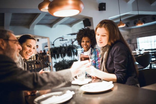 istock Businesspeople having meeting in in high end restaurant 911977664