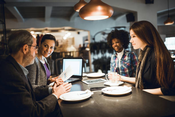 Businesspeople having meeting in in high end restaurant