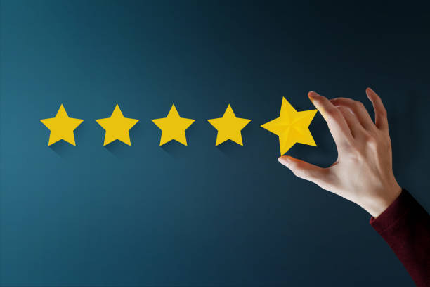 istock Customer Experience Concept, Best Excellent Services for Satisfaction present by Hand of Client giving a Five Star Rating 911978082