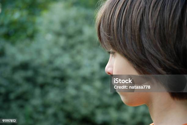 Profile Of A Dark Haired Boy Stock Photo - Download Image Now - Child, Profile View, Sadness