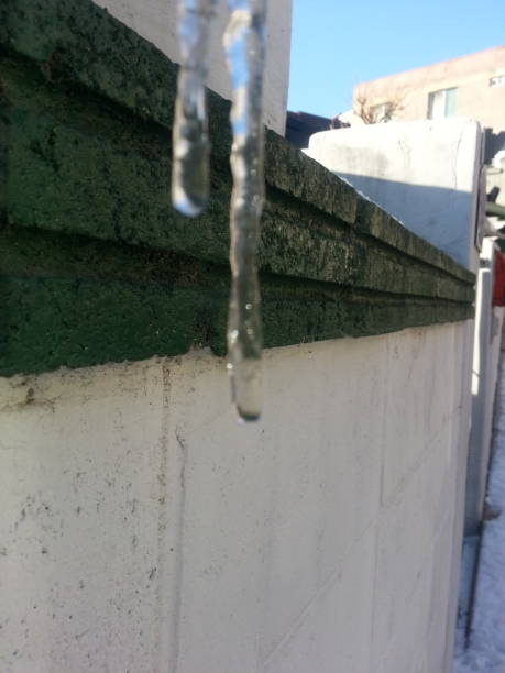istock Frozen water flowing from drain or sanitary pipe in winter season 911978178