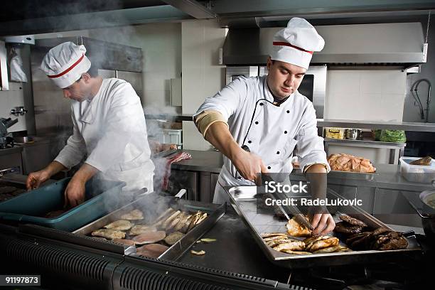 Two Chefs Stock Photo - Download Image Now - Busy, Chef, Commercial Kitchen