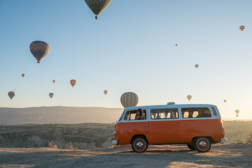 Cappadocia,Türkey - December 02, 2017:Hot air balloons flying over valley in the morning and people camping in Cappadocia. Turkey