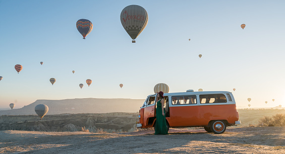 Cappadocia,Türkey - December 02, 2017:Hot air balloons flying over valley in the morning and people camping in Cappadocia. Turkey