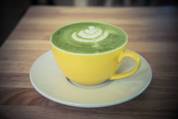 istock hot green tea , healthy drink water on the table 911983490