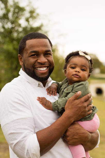 istock African American father holding his daughter. 911983520