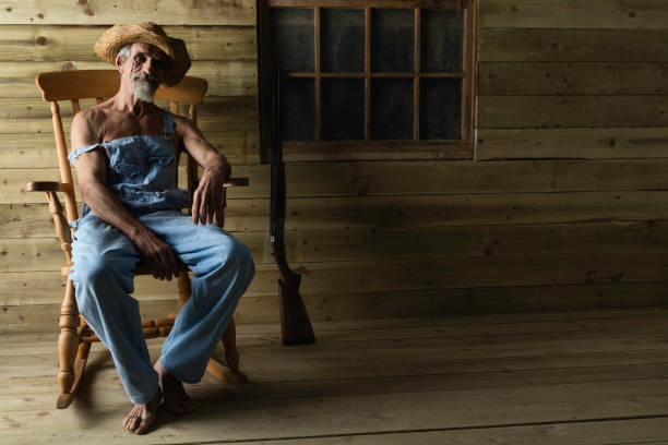 istock Hick in bib overalls and straw hat 911988906