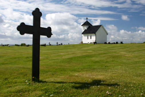 Stavkirke church at the cemetery park in Norway in summer. High quality photo