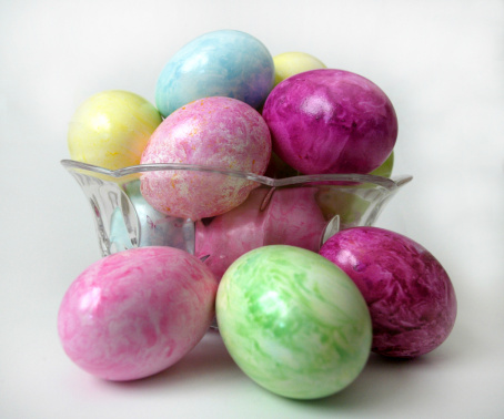Marbled and speckled Easter eggs in a crystal bowl.