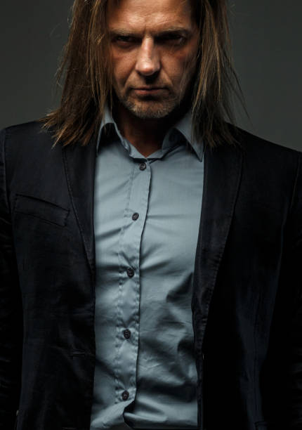 istock Portrait of stylish long-haired man. 911999242