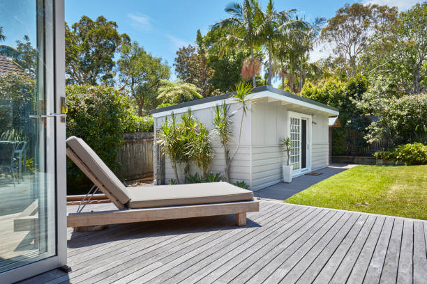 Lounge chair outside house on sunny day