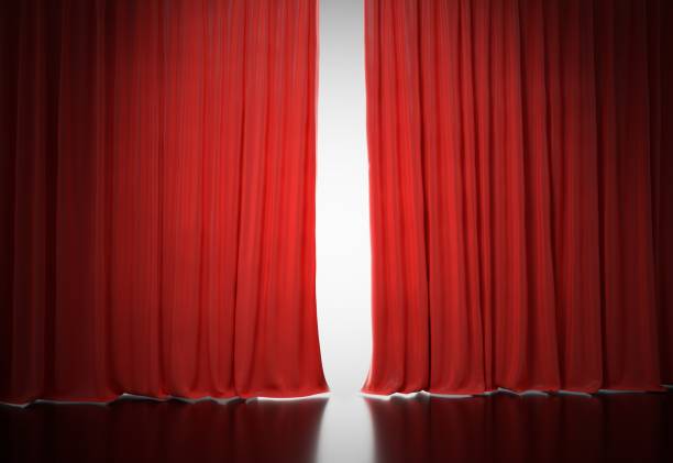 istock Bright light shining behind red curtains in theatre. 3D rendered illustration. 912000404