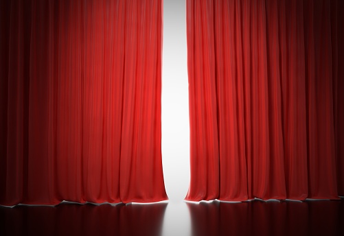 Bright light shining behind red curtains in theatre. 3D rendered illustration.