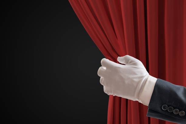 Actor is pulling red curtains in theatre with hand. Actor is pulling red curtains in theatre with hand. opera photos stock pictures, royalty-free photos & images