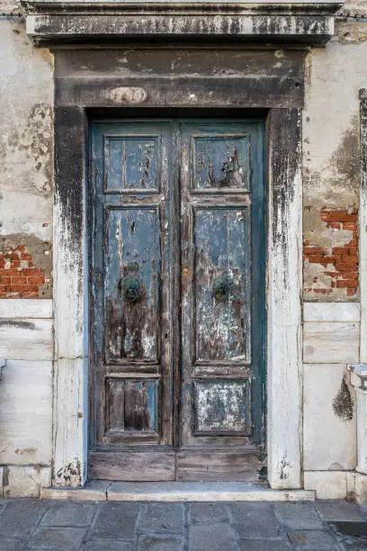 Photo of Old windows and home doors on the island of Murano, Venice