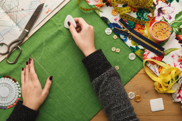 istock Top view on fashion designer working at messy table 912003358