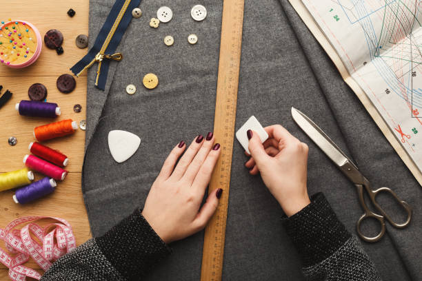 istock Top view on fashion designer working at messy table 912003468