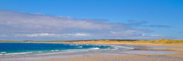istock Dunnet Beach, a sweeping arc of white sandy beach backed by rolling sand dunes on the north coast of the Scottish Highlands 912004424