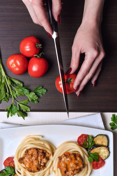 istock Italian pasta with meat in a cafe. Dinner in the restaurant. Han 912004442