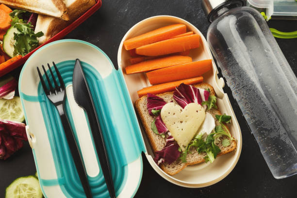 istock Lunch box with healthy food on black table background 912004576