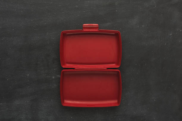 Empty plastic food container on black background Red empty open plastic lunch box for food storage on black background with copy space, top view lunch box stock pictures, royalty-free photos & images