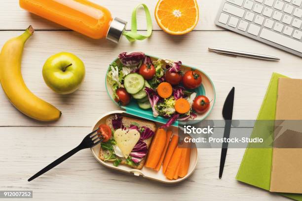 Healthy Dinner From Lunch Box At Office Working Table Stock Photo - Download Image Now