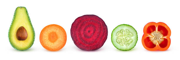 Isolated vegetable halves Isolated vegetable slices. Fresh vegetables cut in half (avocado, carrot, beetroot, cucumber, bell pepper) in a row isolated on white background with clipping path pile of carrots stock pictures, royalty-free photos & images