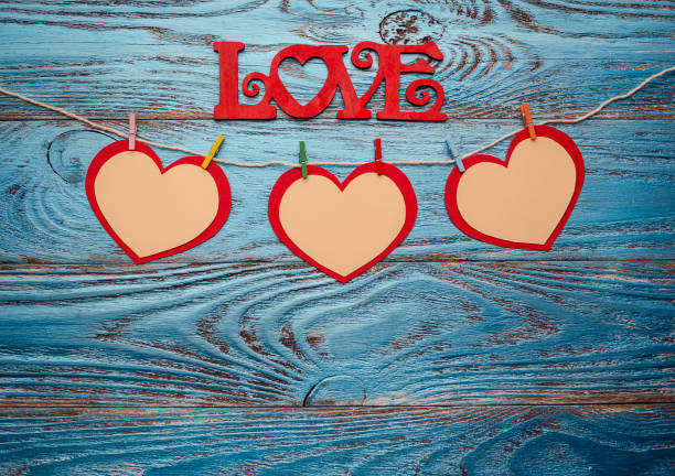 istock Valentines day background decorated with red hearts and love card/copy space 912007512