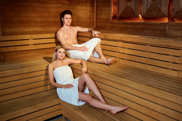 istock Couple in towels resting in the sauna 912007596