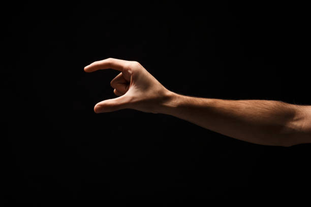 istock Male hand measuring something, cutout, gesture 912016286