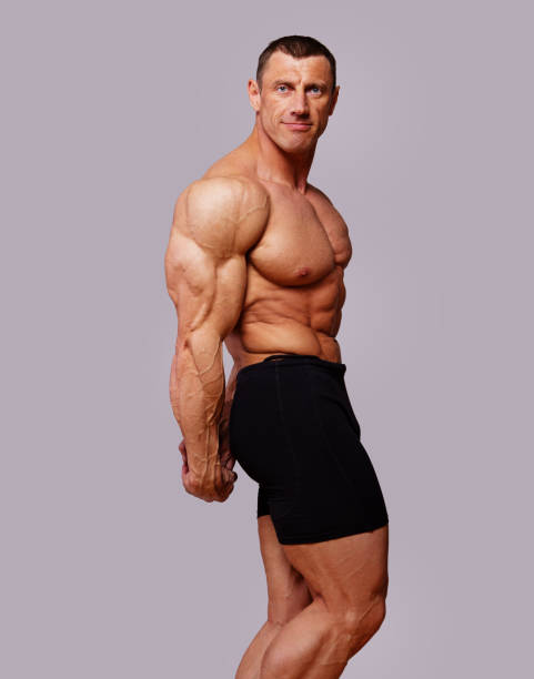 istock Portrait of muscle man on competitions 912018962