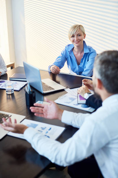 istock Lady boss talking to staff at meeting 912028752