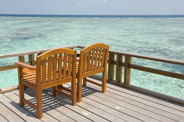 istock Chairs near by the beach on a deck 91202964