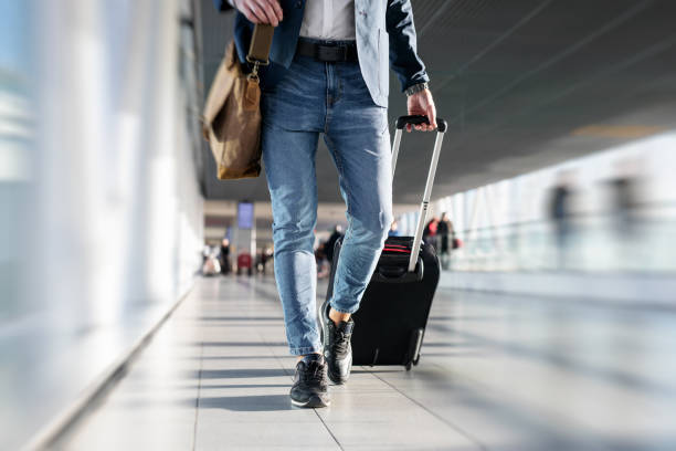 istock Man walking in airport 912035872