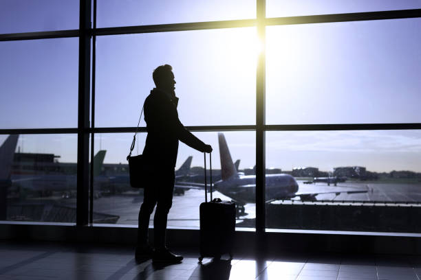 istock Businessman standing in airport 912035888