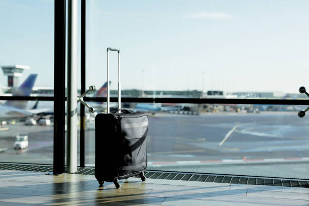 istock Hand luggage suitcase in airport 912036608