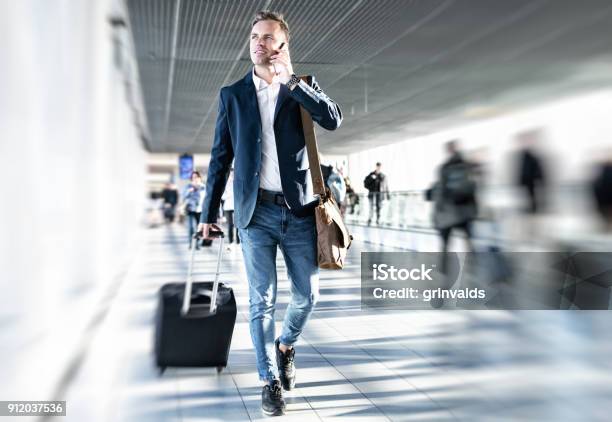 Businessman Walking In Airport Stock Photo - Download Image Now - Airport, Business Travel, Businessman