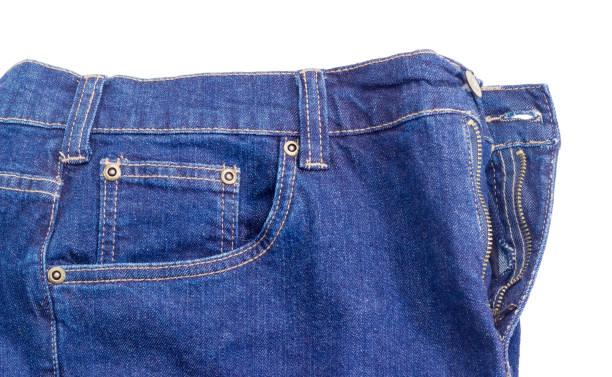 istock Fragment of the new classical blue jeans on white background 912038884