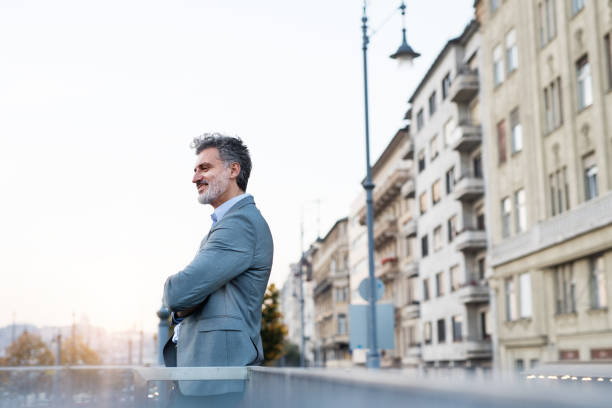 istock Mature businessman in a city. 912049400