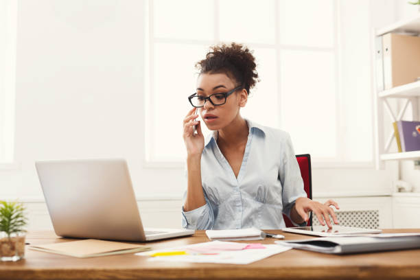 istock Concentrated business woman at work talking on phone 912052030