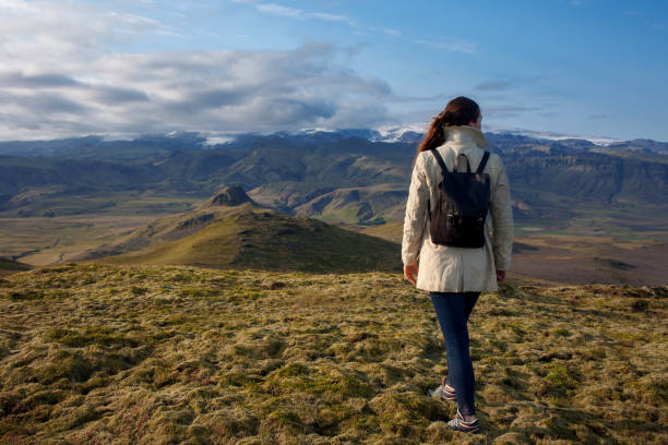 istock Young woman in the mountains, alone with nature 912053196