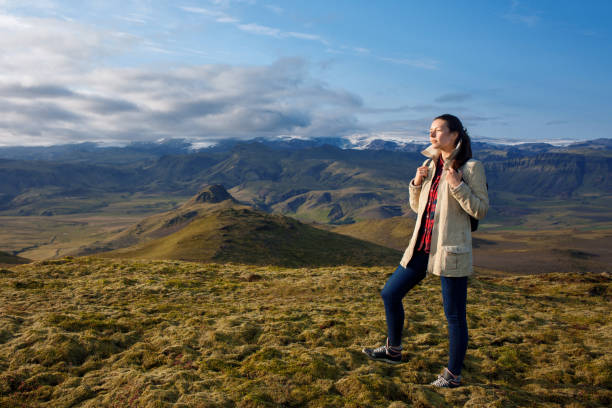 istock Young woman in the mountains, alone with nature 912053206