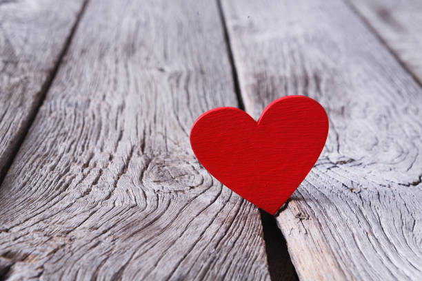 Valentine day, red handmade heart on grey wood background. Happy lovers day card mockup, copy space. Valentine's Day, love, romantic concept