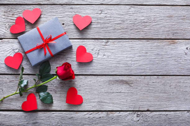 istock Valentine background, handmade hearts, rose and gift on wood 912062726