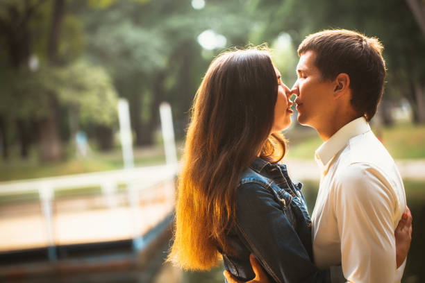 istock Beautiful young couple on the lake background 912064126